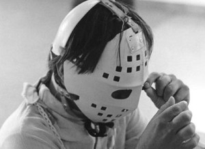 Boy wearing protective headgear and mask